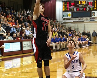 Turner Johnson(11) of Salem hooks a shot into the basket as Braeden O'Shaungnessy(3) of Poland watches onduring the 2nd half as Salem takes on Poland Seminary, Thursday, March 9, 2017 at Boardman High School. Salem won 70-66...(Nikos Frazier | The Vindicator)..