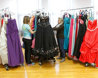        ROBERT K. YOSAY  | THE VINDICATOR.     . Blair Nulf and Darlene McElroy..  go through  the racks and racks of dresses..East Palestine City Schools will unveil EppyÕs Attic, a program designed to provide formal and semi-formal attire ..-30-
