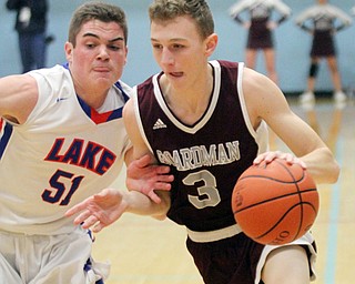 William D Lewis the Vindicator  Boardman'sHolden Lipke(3) drives around Lakes Jake Schultz(51).