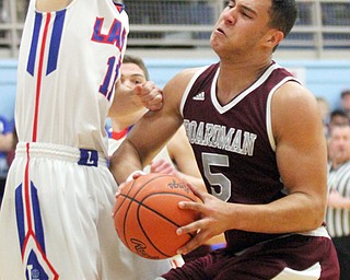 William D Lewis the Vindicator  Boardman'sTravis Koontz(5) tries to pass around LakesDrew Delap(11).