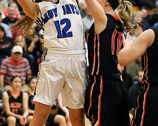 03-09-17 -Girls Basketball-  1st. qtr., Jackson-Milton's #12 Kaitlyn Totani scores over Dalton's #11 Ellie Martinez.  Dalton Bulldogs vs Jackson-Milton Blue Jays at Perry High School in Massillon, OH.