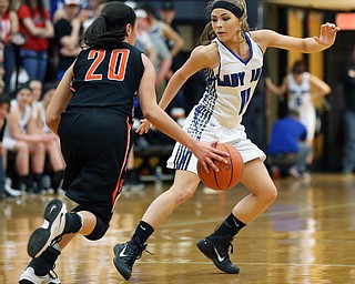 03-09-17 -Girls Basketball-  2nd. qtr., Jackson-Milton's #11 Ashley Totani defends against Dalton's #20 Makenna Geiser.  Dalton Bulldogs vs Jackson-Milton Blue Jays at Perry High School in Massillon, OH.