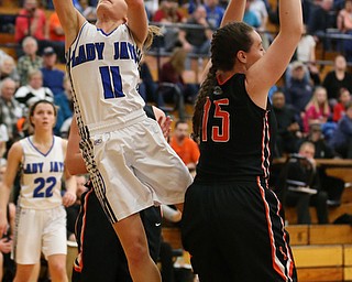 03-09-17 -Girls Basketball-  2nd. qtr., Jackson-Milton's #11 Ashley Totani scores past Dalton's #15 Lauran Hicks.  Dalton Bulldogs vs Jackson-Milton Blue Jays at Perry High School in Massillon, OH.