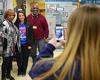 COLUMBIANA, OHIO - MARCH 9, 2017: Crestview Senior Taylor Gilkinson, center, poses for a picture with Alvin Wesley and his sister Janice W. Kelsey, while her fired Kasey Landesberger takes the picture on her cell phone , Thursday morning at Crestview High School. DAVID DERMER | THE VINDICATOR