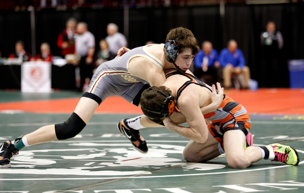 South Range's Kyle Keenan, left, works against Ridgewood's Colton Bethel in a first round 106 pound match during the Division III Ohio state wrestling tournament at the Ohio State University Thursday, March 9, 2017. (Photo by Paul Vernon)