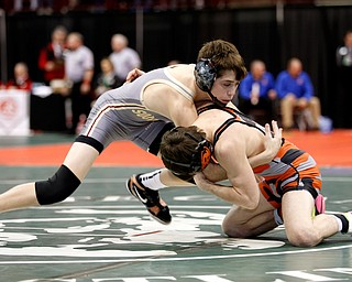 South Range's Kyle Keenan, left, works against Ridgewood's Colton Bethel in a first round 106 pound match during the Division III Ohio state wrestling tournament at the Ohio State University Thursday, March 9, 2017. (Photo by Paul Vernon)