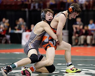 South Range's Kyle Keenan, left, works against Ridgewood's Colton Bethel in a first round 106 pound match during the Division III Ohio state wrestling tournament at the Ohio State University Thursday, March 9, 2017. (Photo by Paul Vernon)