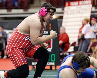 Columbiana's Tim Davin, left, reacts after his pin of Harrison Central's Brenton Stull in a first round 285 match during the Division III Ohio state wrestling tournament at the Ohio State University Thursday, March 9, 2017. (Photo by Paul Vernon)
