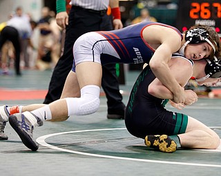 Austintown Fitch's Gus Sutton, left, works against Mason's Colin Schuster in a first round 120 pound  match during the Division I Ohio state wrestling tournament at the Ohio State University Thursday, March 9, 2017. (Photo by Paul Vernon)