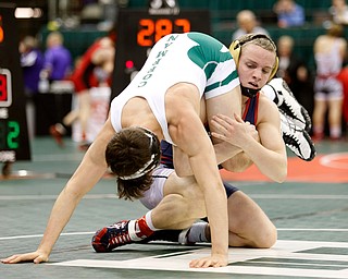 Austintown Fitch's Andrew Fairbanks, right, works against Dublin Coffman's Ben Yost in a first round 138 pound  match during the Division I Ohio state wrestling tournament at the Ohio State University Thursday, March 9, 2017. (Photo by Paul Vernon)