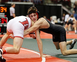 Giard's Dakota McCloskey, right, works against Libson Beaver's Skyler Lasure in a first round 120 pound match during the Division II Ohio state wrestling tournament at the Ohio State University Thursday, March 9, 2017. (Photo by Paul Vernon)