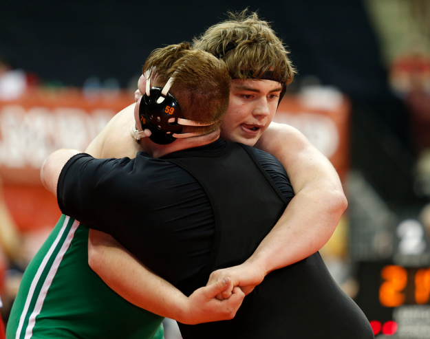West Branch's Ian Sharp, right, works against Elida's Noah Meeker in a first round 285 pound match during the Division II Ohio state wrestling tournament at the Ohio State University Thursday, March 9, 2017. (Photo by Paul Vernon)