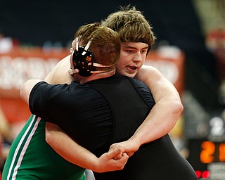 West Branch's Ian Sharp, right, works against Elida's Noah Meeker in a first round 285 pound match during the Division II Ohio state wrestling tournament at the Ohio State University Thursday, March 9, 2017. (Photo by Paul Vernon)