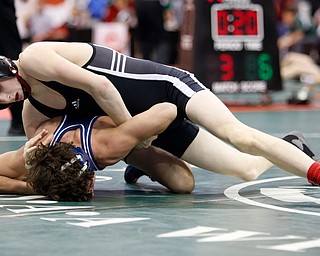 Libson Beaver's Cole McComas, top, works against Germantown Valley View's Joey Dima in a first round 106 pound match during the Division II Ohio state wrestling tournament at the Ohio State University Thursday, March 9, 2017. (Photo by Paul Vernon)