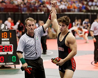 Canfield's Georgio Poullas, right, is declared the winner against  McConnelsville Morgan's Wesley Pauley  in a first round 160 pound match during the Division II Ohio state wrestling tournament at the Ohio State University Thursday, March 9, 2017. (Photo by Paul Vernon)