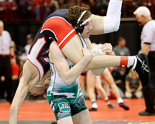 West Branch's Dylan Miller, top, takes Circleville's Greg Brewer to the mat in a first round 145 pound match during the Division II Ohio state wrestling tournament at the Ohio State University Thursday, March 9, 2017. (Photo by Paul Vernon)
