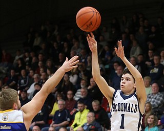Zach Rasile(1) of McDonald goes up for three during the 1st quarter as Southern Local takes on McDonald, Friday, March 10, 2017 at Struthers High School. McDonald won 96-43...(Nikos Frazier | The Vindicator)..
