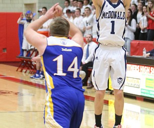 Zach Rasile(1) of McDonald goes up for three during the 1st quarter as Southern Local takes on McDonald, Friday, March 10, 2017 at Struthers High School. McDonald won 96-43...(Nikos Frazier | The Vindicator)..