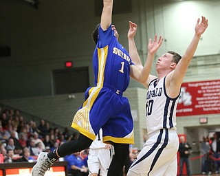 Dominic Pugliano(1) of Southern goes up for the rebound against Magill(10) of McDonald during the 2nd quarter as Southern Local takes on McDonald, Friday, March 10, 2017 at Struthers High School. McDonald won 96-43...(Nikos Frazier | The Vindicator)..