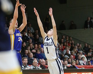 Ethan West(24) of Southern goes up for three as Zach Rasile(1) of McDonald tries to block his shot during the 2nd quarter as Southern Local takes on McDonald, Friday, March 10, 2017 at Struthers High School. McDonald won 96-43...(Nikos Frazier | The Vindicator)..