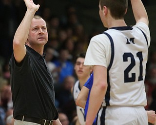 McDonald head coach Jeff Rasile high-fives Joe Ragazzine(21) during the 3rd quarter as Southern Local takes on McDonald, Friday, March 10, 2017 at Struthers High School. McDonald won 96-43...(Nikos Frazier | The Vindicator)..