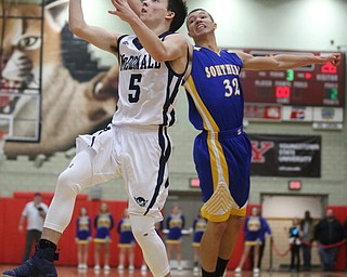Josh Celli(5) of McDonald goes up for a layup during the 3rd quarter as Southern Local takes on McDonald, Friday, March 10, 2017 at Struthers High School. McDonald won 96-43...(Nikos Frazier | The Vindicator)..
