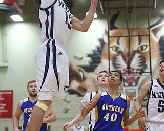 Dylan Portolese(13) of McDonald goes up for a break-away layup during the 3rd quarter as Southern Local takes on McDonald, Friday, March 10, 2017 at Struthers High School. McDonald won 96-43...(Nikos Frazier | The Vindicator)..