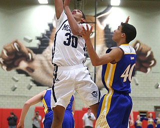 Braedon Poole(30) of McDonald puts up the ball during the 3rd quarter as Southern Local takes on McDonald, Friday, March 10, 2017 at Struthers High School. McDonald won 96-43...(Nikos Frazier | The Vindicator)..
