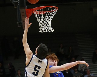 Josh Celli(5) of McDonald goes up for a layup during the 4th quarter as Southern Local takes on McDonald, Friday, March 10, 2017 at Struthers High School. McDonald won 96-43...(Nikos Frazier | The Vindicator)..