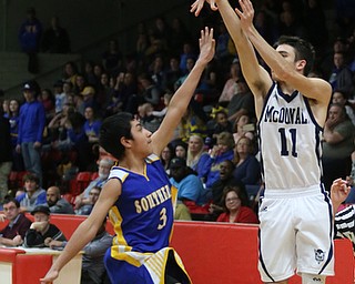 Caleb Emerson(11) of McDonald goes up for three as Devin Lopez(3) of Southern tries to block his shot during the 4th quarter as Southern Local takes on McDonald, Friday, March 10, 2017 at Struthers High School. McDonald won 96-43...(Nikos Frazier | The Vindicator)..