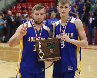 Southern players hold up their second place division IV trophy after McDonald beat Southern Local, 96-43, Friday, March 10, 2017 at Struthers High School. ..(Nikos Frazier | The Vindicator)..