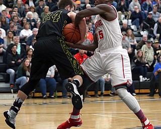MICHAEL G TAYLOR | THE VINDICATOR- 03-10-17  -Basketball-  2nd qtr., as Labrae's #15 Carlton Brown drives to the hoop, Garfield's #24 Ryan Brown ties him up for a jump ball. Boys high School basketball Garfield G-Men vs Labrae Vikings D3 Distric Finals at Warren G. Harding High School, Warren, OH