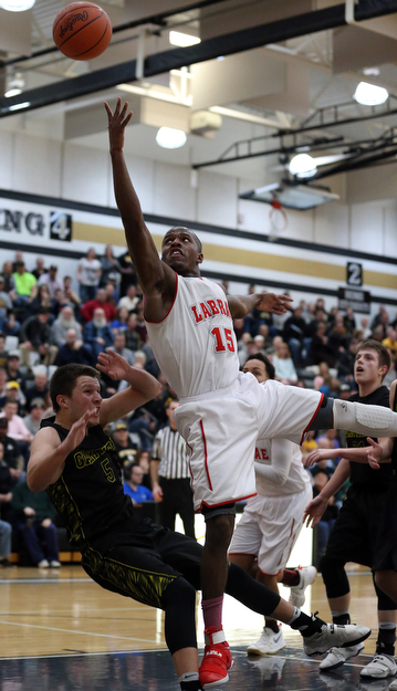 MICHAEL G TAYLOR | THE VINDICATOR- 03-10-17  -Basketball-  2nd qtr., Labrae's #15 Carlton Brown  drives against Garfield's #5 Tommy Bissler . Boys high School basketball Garfield G-Men vs Labrae Vikings D3 Distric Finals at Warren G. Harding High School, Warren, OH