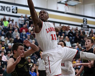 MICHAEL G TAYLOR | THE VINDICATOR- 03-10-17  -Basketball-  2nd qtr., Labrae's #15 Carlton Brown  drives against Garfield's #5 Tommy Bissler . Boys high School basketball Garfield G-Men vs Labrae Vikings D3 Distric Finals at Warren G. Harding High School, Warren, OH