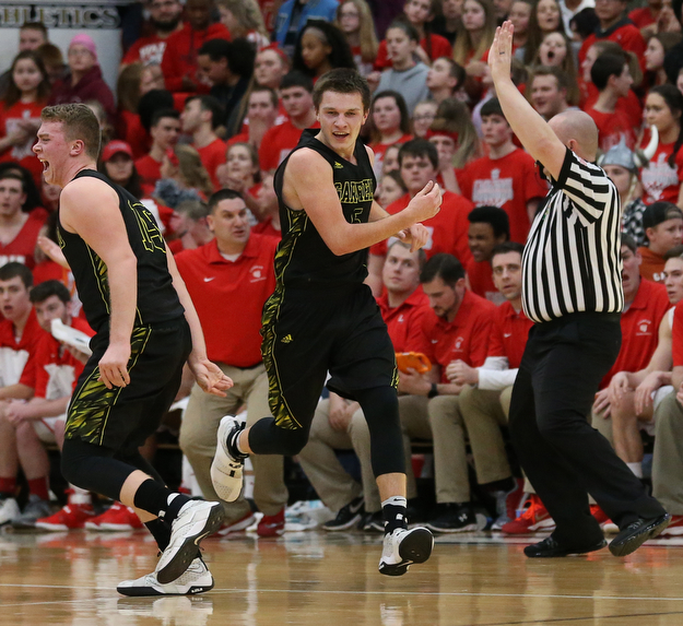 MICHAEL G TAYLOR | THE VINDICATOR- 03-10-17  -Basketball-  2nd qtr., Garfield's #15 Dalton Fall and Garfield's #5 Tommy Bissler celebrate a made 3 pointer by Bisslerl. Boys high School basketball Garfield G-Men vs Labrae Vikings D3 Distric Finals at Warren G. Harding High School, Warren, OH