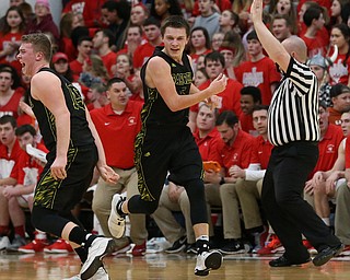 MICHAEL G TAYLOR | THE VINDICATOR- 03-10-17  -Basketball-  2nd qtr., Garfield's #15 Dalton Fall and Garfield's #5 Tommy Bissler celebrate a made 3 pointer by Bisslerl. Boys high School basketball Garfield G-Men vs Labrae Vikings D3 Distric Finals at Warren G. Harding High School, Warren, OH