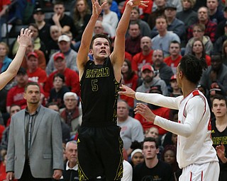 MICHAEL G TAYLOR | THE VINDICATOR- 03-10-17  -Basketball-  3rd qtr., Garfield's #5 Tommy Bissler nails a quarter ending 3 pointer. Boys high School basketball Garfield G-Men vs Labrae Vikings D3 Distric Finals at Warren G. Harding High School, Warren, OH