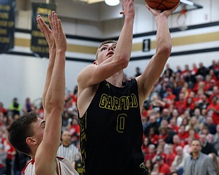 MICHAEL G TAYLOR | THE VINDICATOR- 03-10-17  -Basketball-  4th qtr., Garfield's #0 Zack Smith scores over Labrae's #3 Aaron Iler. Boys high School basketball Garfield G-Men vs Labrae Vikings D3 Distric Finals at Warren G. Harding High School, Warren, OH
