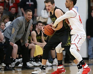 MICHAEL G TAYLOR | THE VINDICATOR- 03-10-17  -Basketball-  4th qtr., Garfield's #5 Tommy Bissler is defended by Labrae's #40 Walt Allie. Boys high School basketball Garfield G-Men vs Labrae Vikings D3 Distric Finals at Warren G. Harding High School, Warren, OH