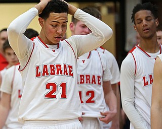 MICHAEL G TAYLOR | THE VINDICATOR- 03-10-17  -Basketball-   After losing the district final to Garfield, Labrae's #21 Tyler Stephens is heartbroken. Boys high School basketball Garfield G-Men vs Labrae Vikings D3 Distric Finals at Warren G. Harding High School, Warren, OH