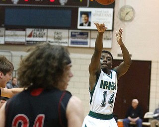 Dakota Hobbs(14) of Ursuline puts up three during the 1st quarter as Salem takes on Ursuline in the Division II District Final, Saturday, March 11, 2017 at Boardman High School. Ursuline won 70-33...(Nikos Frazier | The Vindicator)..