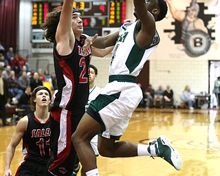 Dakota Hobbs(14) of Ursuline goes up to the net for two during the 1st quarter as Salem takes on Ursuline in the Division II District Final, Saturday, March 11, 2017 at Boardman High School. Ursuline won 70-33...(Nikos Frazier | The Vindicator)..