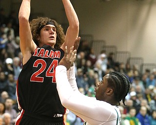 Chase Ackerman(24) of Salem goes up for two as Anthony Howell(1) of Ursuline tries to block his shot during the 2nd quarter as Salem takes on Ursuline in the Division II District Final, Saturday, March 11, 2017 at Boardman High School. Ursuline won 70-33...(Nikos Frazier | The Vindicator)..