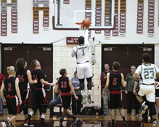 Anthony Howell(1) of Ursuline goes up to the net for two during the 2nd quarter as Salem takes on Ursuline in the Division II District Final, Saturday, March 11, 2017 at Boardman High School. Ursuline won 70-33...(Nikos Frazier | The Vindicator)..