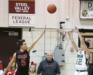 Vince Venzeio(22) of Ursuline puts up three as Jon Gerace(5) of Salem tries to block his shot during the 2nd quarter as Salem takes on Ursuline in the Division II District Final, Saturday, March 11, 2017 at Boardman High School. Ursuline won 70-33...(Nikos Frazier | The Vindicator)..