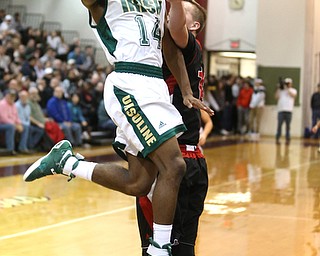 Dakota Hobbs(14) of Ursuline goes up for a layup during the 3rd quarter as Salem takes on Ursuline in the Division II District Final, Saturday, March 11, 2017 at Boardman High School. Ursuline won 70-33...(Nikos Frazier | The Vindicator)..