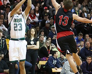 Devan Keevey(23) of Ursuline goes up for three as Zach Bezon(13) of Salem tries to block his shot during the 3rd quarter as Salem takes on Ursuline in the Division II District Final, Saturday, March 11, 2017 at Boardman High School. Ursuline won 70-33...(Nikos Frazier | The Vindicator)..