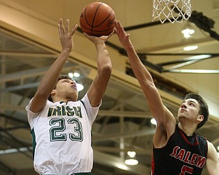 Devan Keevey(23) of Ursuline puts up the rebound as Jon Gerace(5) of Salem tries to block his shot during the 3rd quarter as Salem takes on Ursuline in the Division II District Final, Saturday, March 11, 2017 at Boardman High School. Ursuline won 70-33...(Nikos Frazier | The Vindicator)..