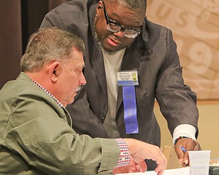        ROBERT K. YOSAY  | THE VINDICATOR.     .Dr Fred Owens and  Rev Lewis Macklin .. decide the next round of words..West Branch eighth grade student Macey Stancato wins the 84th Regional Spelling Bee spelling the championship word "sarcoidosis" correctly..Poland's Sophie Sainato won second place and four-time returnee Angela McKenna from Girard won third place...-30-