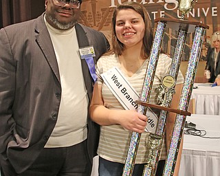        ROBERT K. YOSAY  | THE VINDICATOR.     .Rev Lewis Macklin and Macey Stancato ..West Branch eighth grade student Macey Stancato wins the 84th Regional Spelling Bee spelling the championship word "sarcoidosis" correctly..Poland's Sophie Sainato won second place and four-time returnee Angela McKenna from Girard won third place...-30-